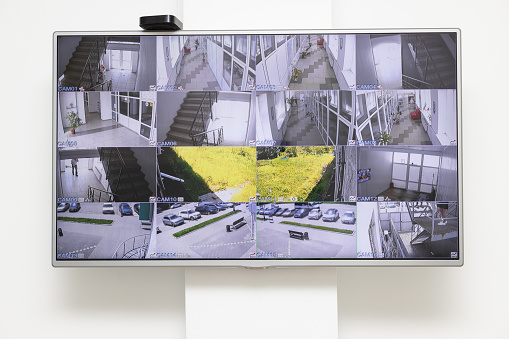 CCTV security system with multiple camera views in office building. Surveillance security system, CCTV Management. white wall background