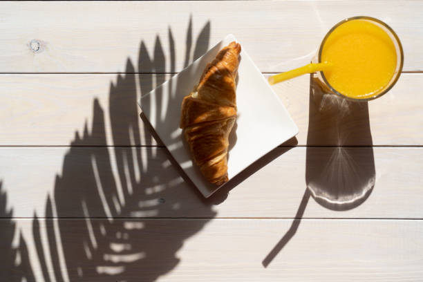 istock Croissant and orange juice 1322176259
