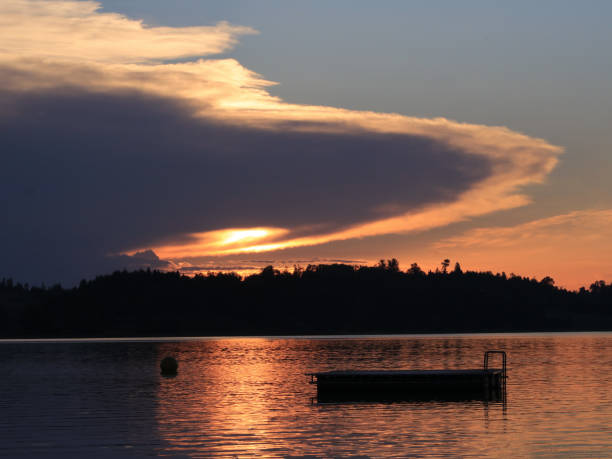 istock UFO shaped cloud with a sun beam shining trough. 1322176606