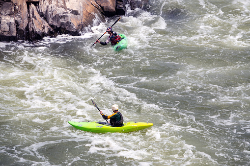 father and son in a kayak