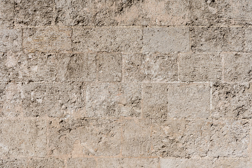 Background texture of a stone wall brown tones