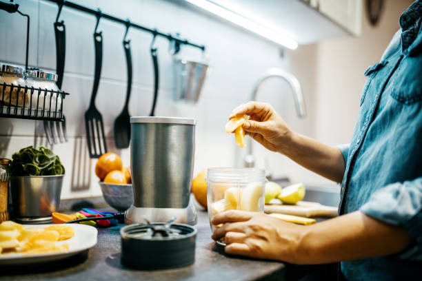 istock Woman blending fruit in the kitchen 1322182508