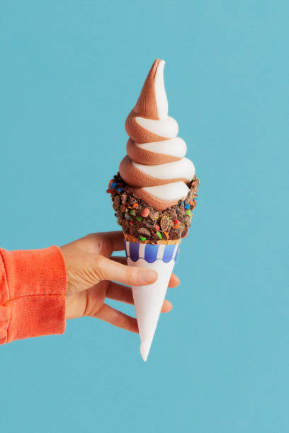 istock ice cream in a child's hand. 1322182873