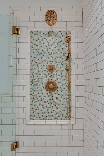 istock White subway tile in new shower with smaller colorful tiles 1322183555