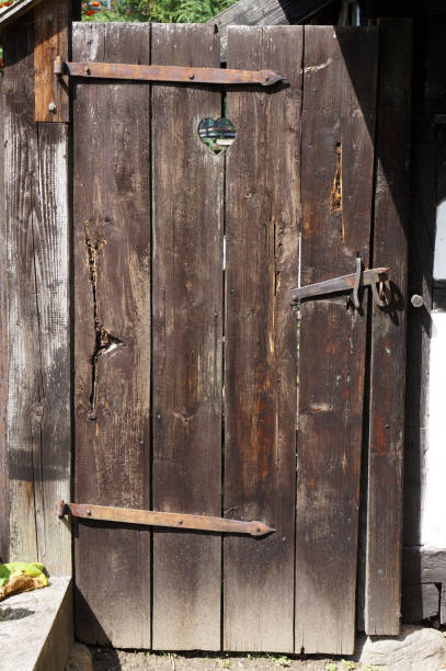 istock Old wooden door with ancient latch in Koszalin, Poland. 1322188002