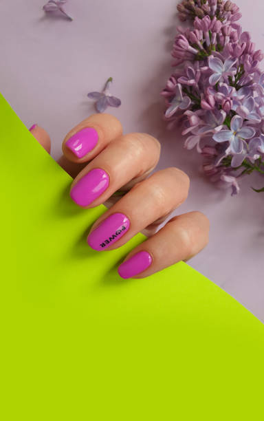 istock female hand beautiful manicure flower lilac 1322188905