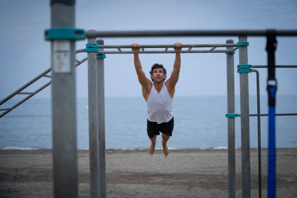 istock Male athlete exercising at the beach 1322189289