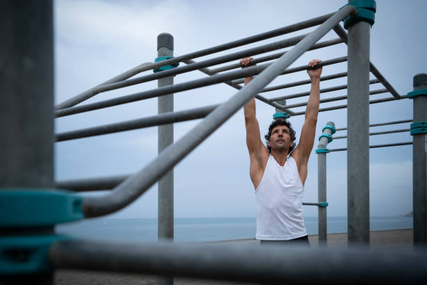 istock Male athlete exercising at the beach 1322189866