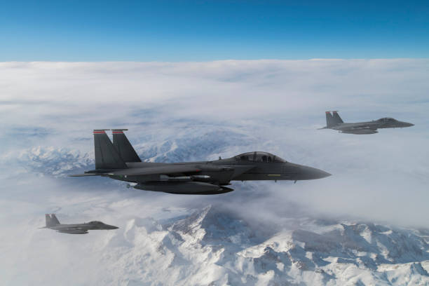 istock Jet fighters flying over the clouds. 1322191490
