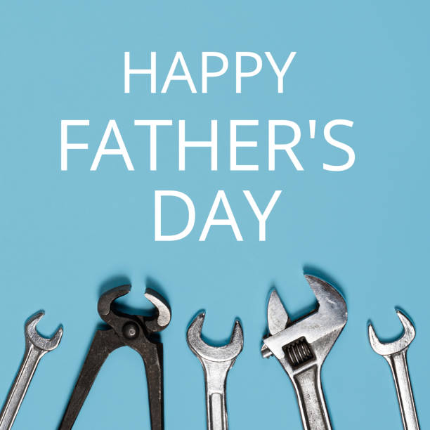 istock Happy father's day banner. Different wrenches on blue background. 1322192204
