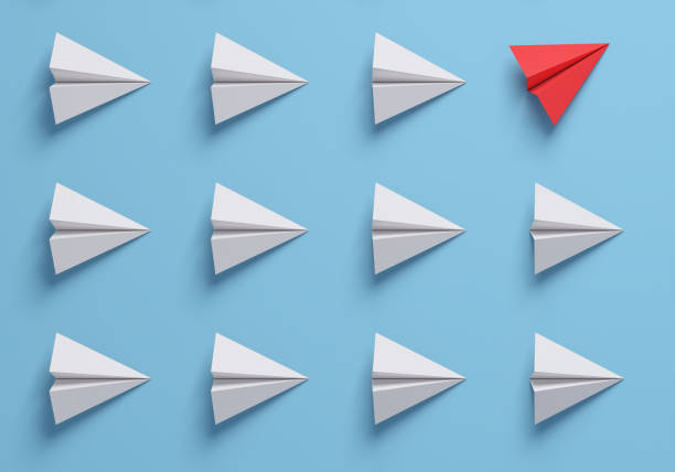 istock Change concepts with red paper airplane leading among white. Think different. 1322192273