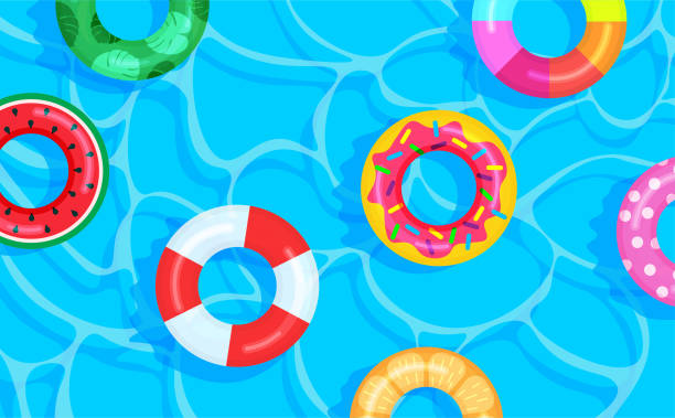 istock Swimming pool background with different color lifebuoys. 1322192443