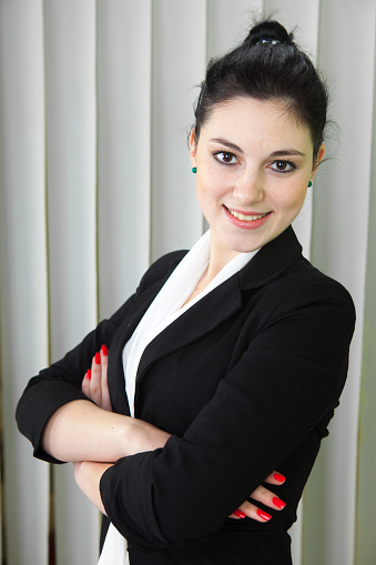 Senior asian businesswoman smiling over white background