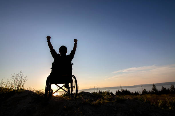 istock Disability man success on wheelchair 1322199439