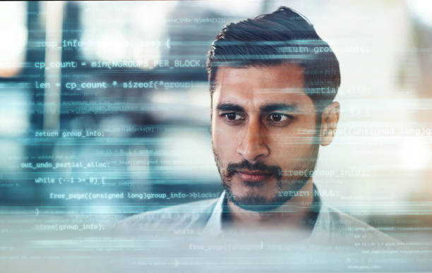 Digitally enhanced shot of a handsome businessman working in the office superimposed over multiple lines of computer code Focused on the code javascript stock pictures, royalty-free photos & images