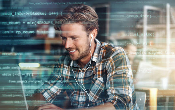 Digitally enhanced shot of a handsome businessman using a laptop superimposed over multiple lines of computer code I get more done when I'm not at the office social listening stock pictures, royalty-free photos & images