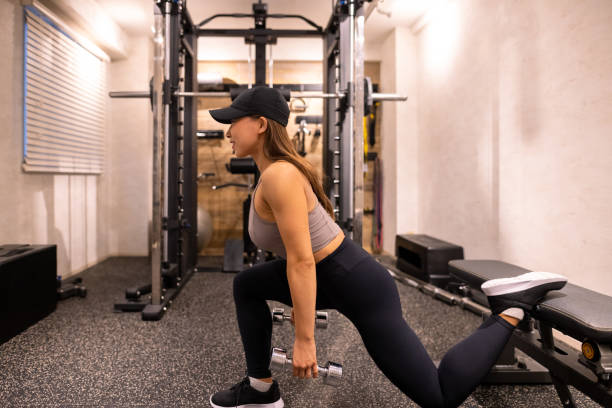 istock Japanese female athlete training in gym 1322203490