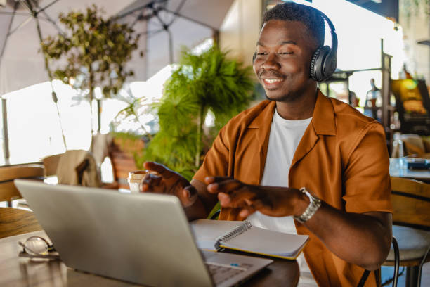 istock African American young man is communicating on a video call 1322203522