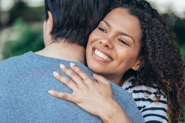 istock Couple hugging outdoors 1322203691