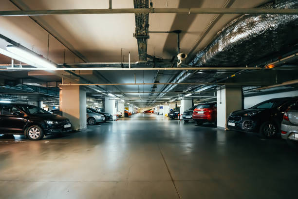 istock Underground garage or modern car parking in mall 1322203853
