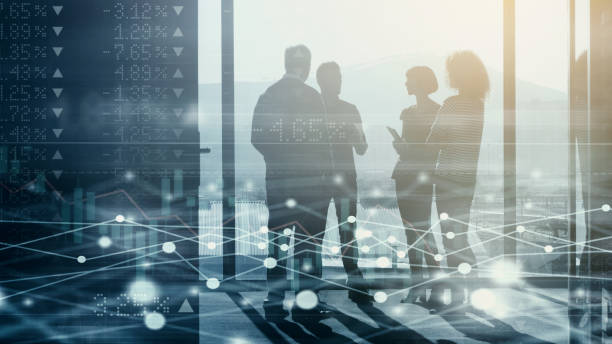 Digitally enhanced shot of a group of businesspeople meeting in the boardroom superimposed over a graph showing the ups and downs of the stock market They're headed for the top digital enhancement stock pictures, royalty-free photos & images