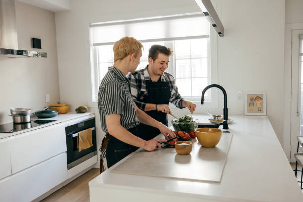 istock Cutting vegetables and having fun preparing lunch together 1322211385