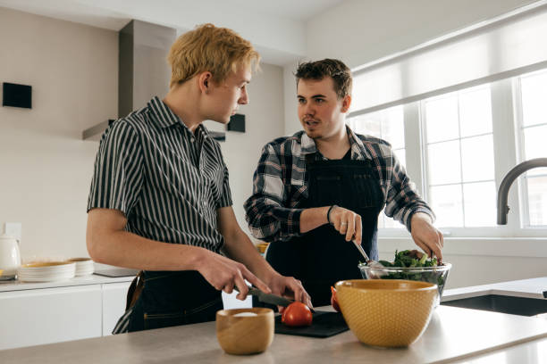 istock LGBT couple preparing healthy lunch together 1322211397