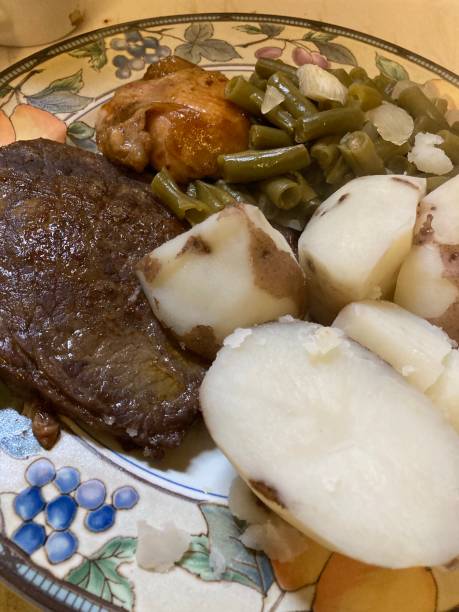 istock Steak and chicken dinner at home. 1322219068