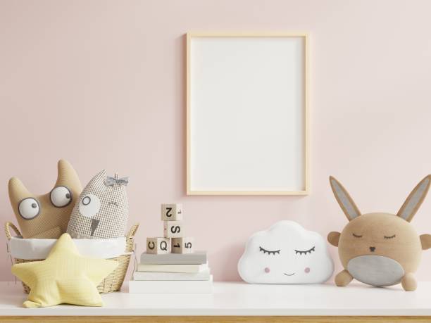 istock Mock up posters in child room interior, posters on empty pink wall background. 1322221633