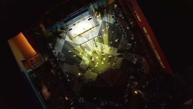 People dancing on the show in a luxury hotel. Aerial view