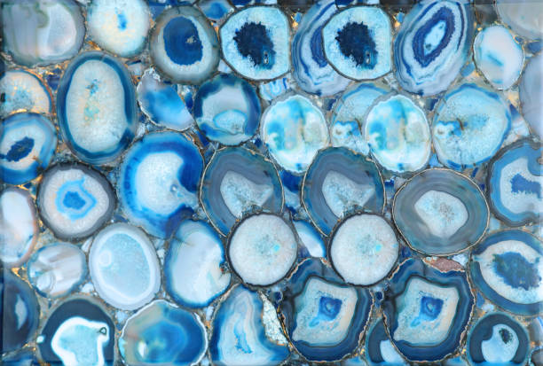 istock Original multi-colored agate stone, from white to blue, cut in the form of a finishing panel 1322227346