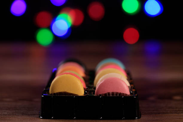 Macarons in every color, Colorful light background of macarons
