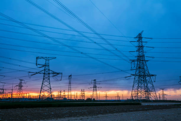istock Pylons, high voltage pylons in the evening 1322228028