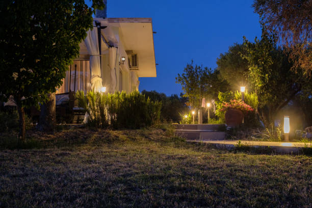 istock Yard and bungalow lit by lanterns. Night on the sea coast. 1322230159
