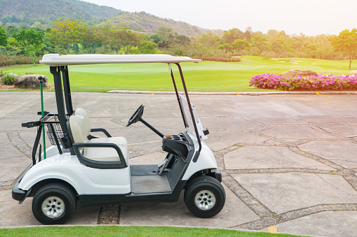 Golf cart on the golf course - Stock Photo