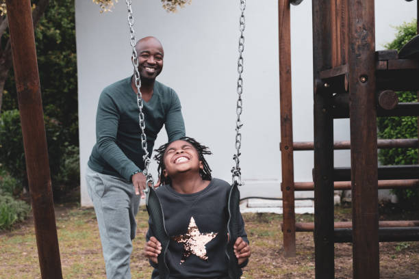 istock Father spending time with his daughter on the swing 1322238124