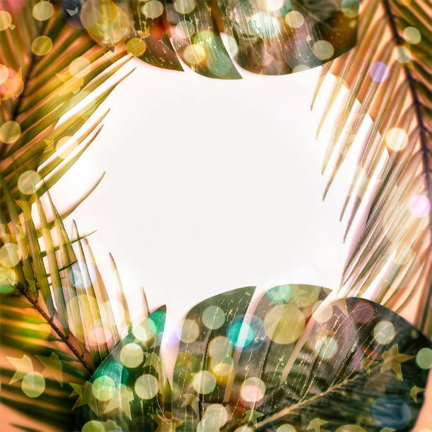 istock Minimal summer concept with palm tree leaf. Creative copyspace with paper frame. Colorful spring  background with paper card note. 1322238162