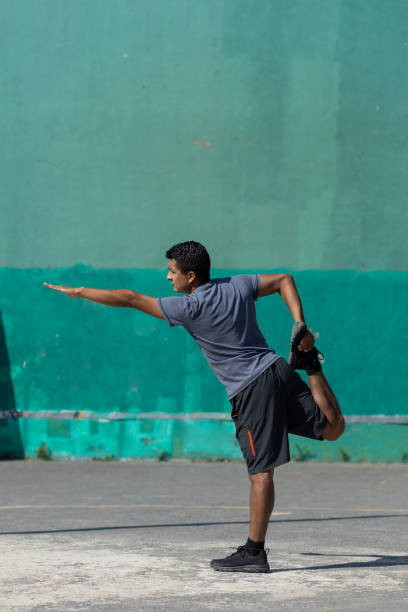 istock Mexican young man warming up outside on sunny day 1322238236
