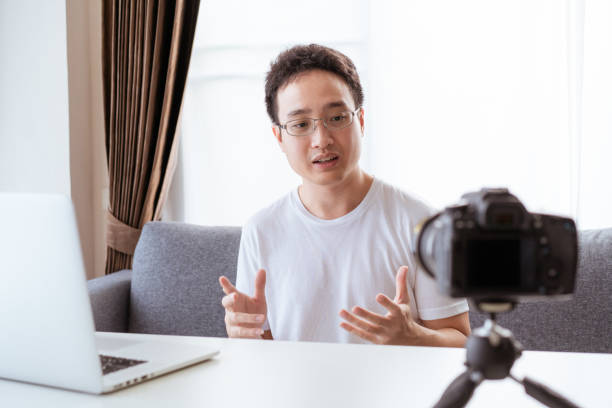 istock Asian young businessman making a video conference at home. 1322238306