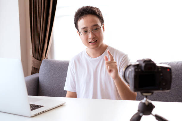 istock Asian young businessman making a video conference at home. 1322238338