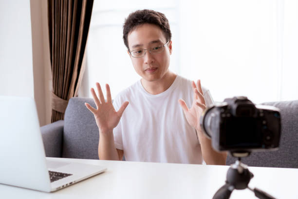 istock Asian young businessman making a video conference at home. 1322238894