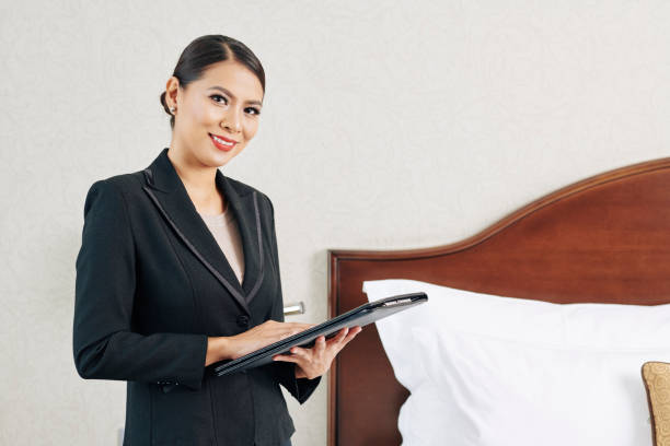 istock Smiling young female hotel manager 1322239126