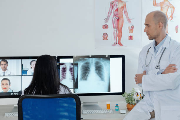 istock Concerned serious doctor discussing lungs x-ray 1322240195