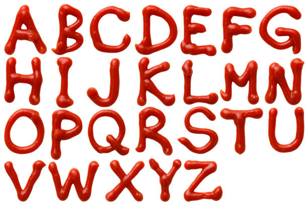 Isolated shot of upper case letters alphabetical order written in ketchup on white background Overhead shot of upper case letters alphabetical order written in ketchup on white background. ketchup stock pictures, royalty-free photos & images