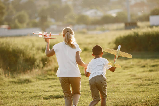 istock Multi-racial family playing in a summer park 1322244657