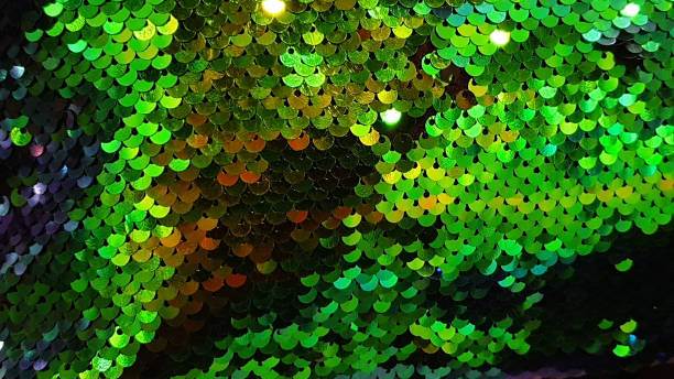 istock Glmour background glitter flex embroiled cloth green red rainbow colors sequin fabric 1322247717