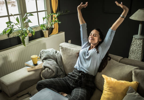 istock Smiling young  woman using mobile phone app playing game, shopping online, ordering delivery 1322248583