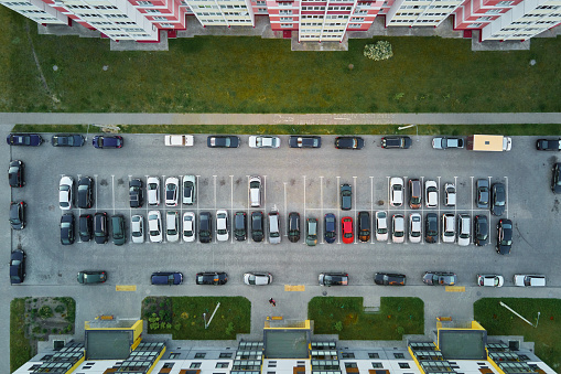Car parking lot near modern house buildings, Aerial view. Living sector