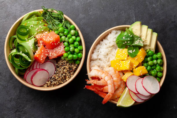 istock Poke bowls with shrimps, salmon, avocado and mango 1322251181