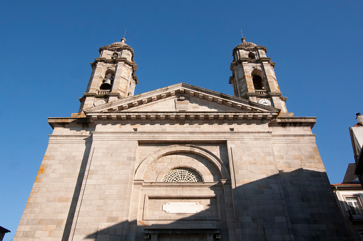 Bell towers and facade of the Concatedral de Santa María church, old town Vigo. Clear blue sky background. Pontevedra province, Galicia, Spain.